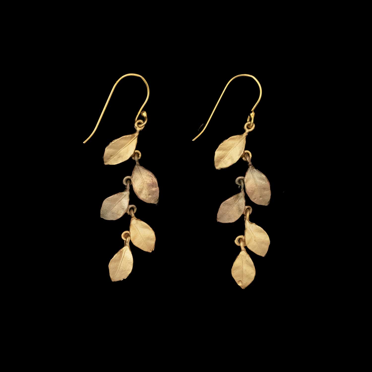 The Golden Autumn Earrings - Long Wire feature five vertically arranged leaves on each earring, shown against a solid black background.