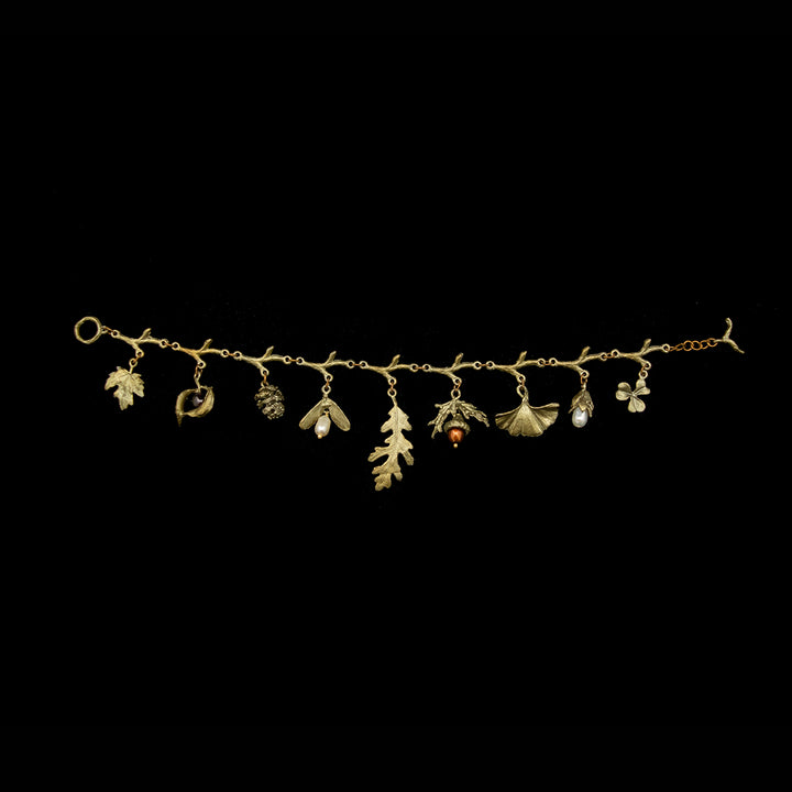 Image of the Michael Michaud Acorn & Oaks Charm Bracelet on a black background