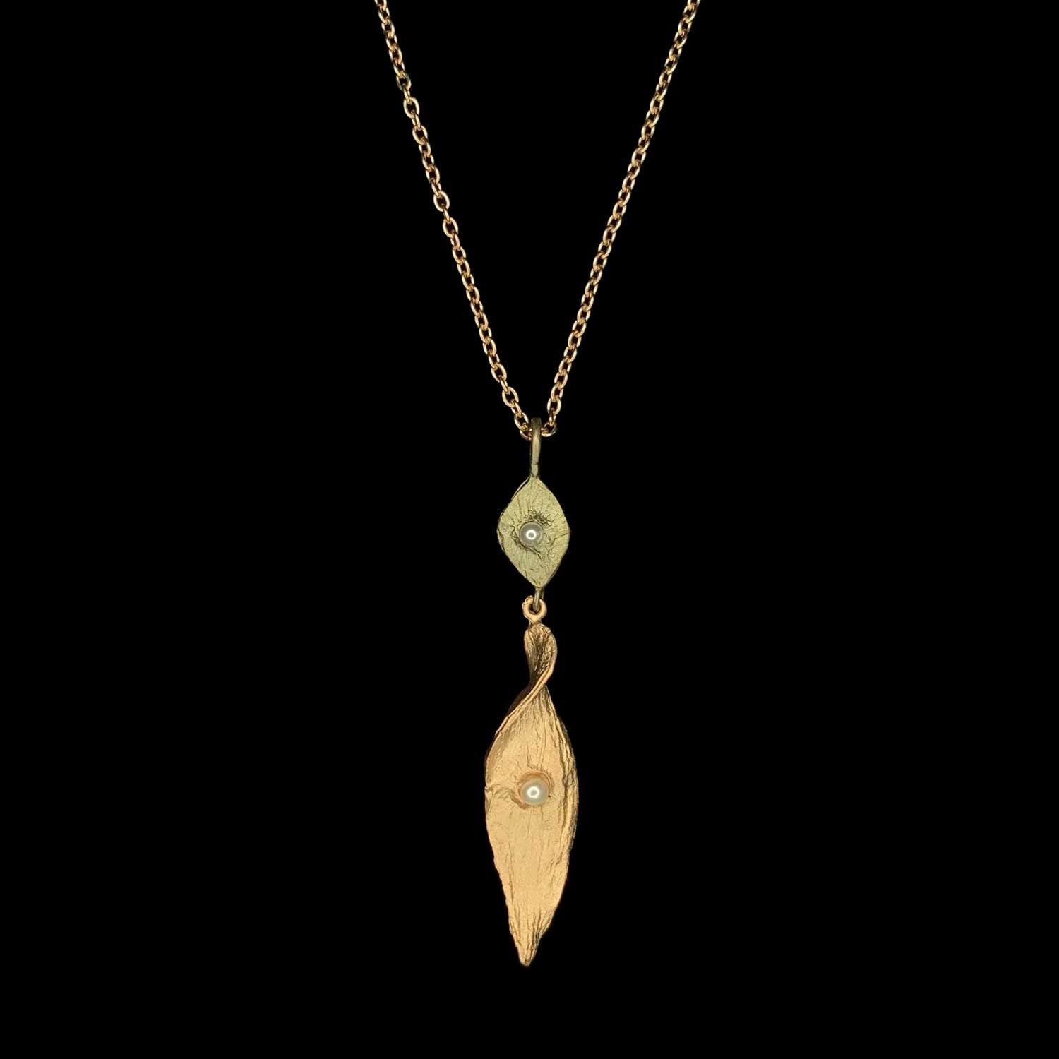 Image of the Michael Michaud Spiral Pod Pendant on a black background